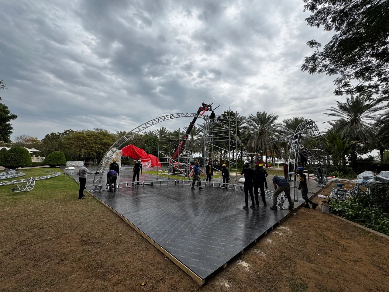 Professional team installing a large Ramadan event tent with sturdy aluminum frame structure