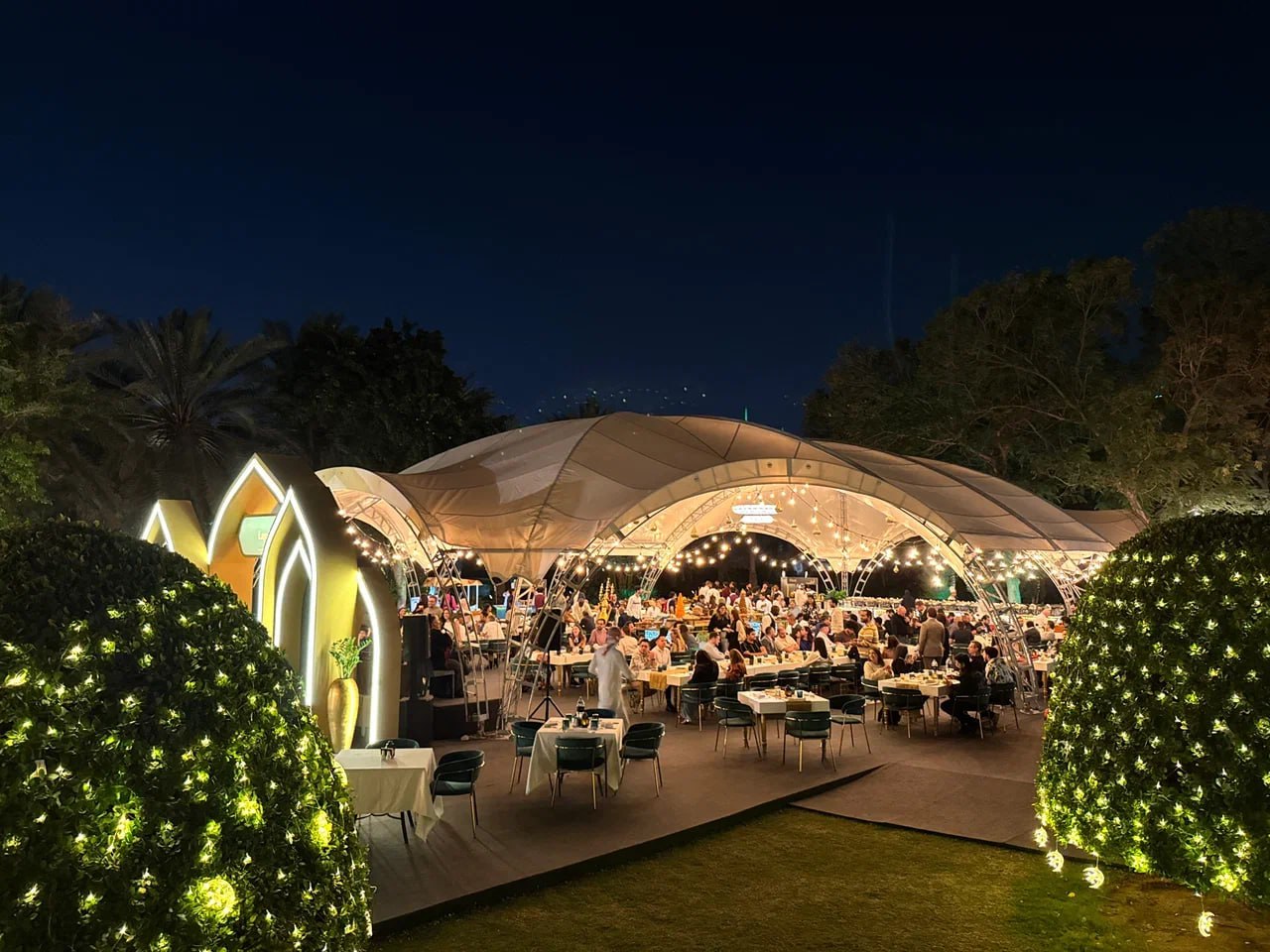 Elegant Ramadan tent interior with decorative lighting and comfortable seating area