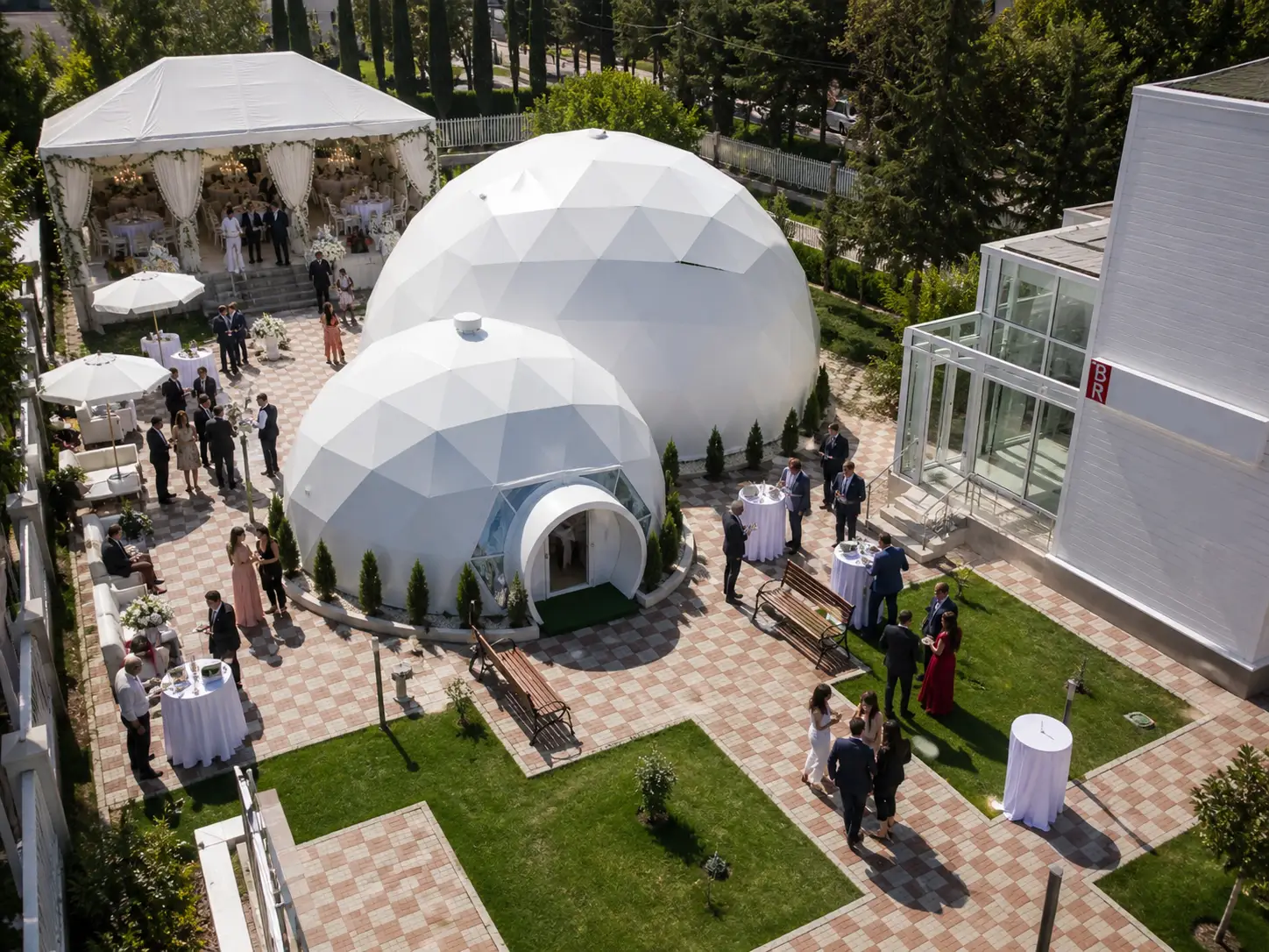 Outdoor wedding in Dubai with elegant tent setup surrounded by desert or beachfront scenery, warm lighting and romantic atmosphere