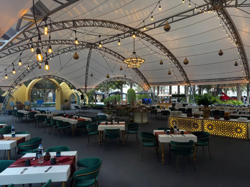Dining tables inside the completed Layali Iftar tent at Kempinski Palm Jumeirah.