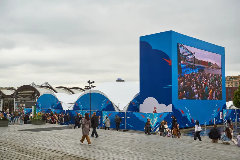 Completed branded arch tent complex for a public festival.
