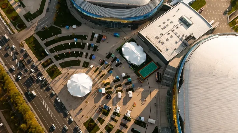 Aerial view of the completed Almaty Open tent complex beside Almaty Arena.