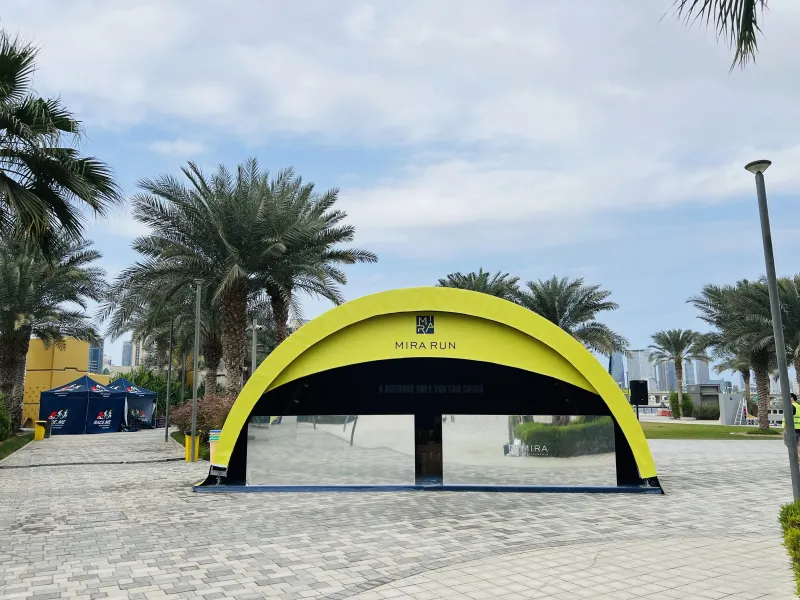 Completed yellow arch tent with MIRA RUN branding for the Mira Run project in Dubai.