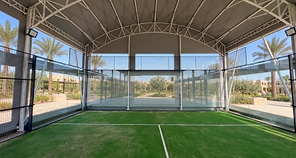 White roof trusses above the padel court