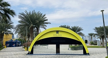 8x4 meter custom branded modular arch tent rental for Mira Run Dubai running event with yellow exterior and blue interior branding
