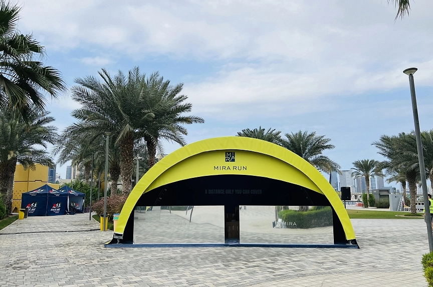 8x4 meter custom branded modular arch tent rental for Mira Run Dubai running event with yellow exterior and blue interior branding