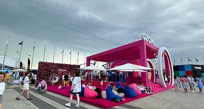 Daytime filming of branded structure in natural lighting