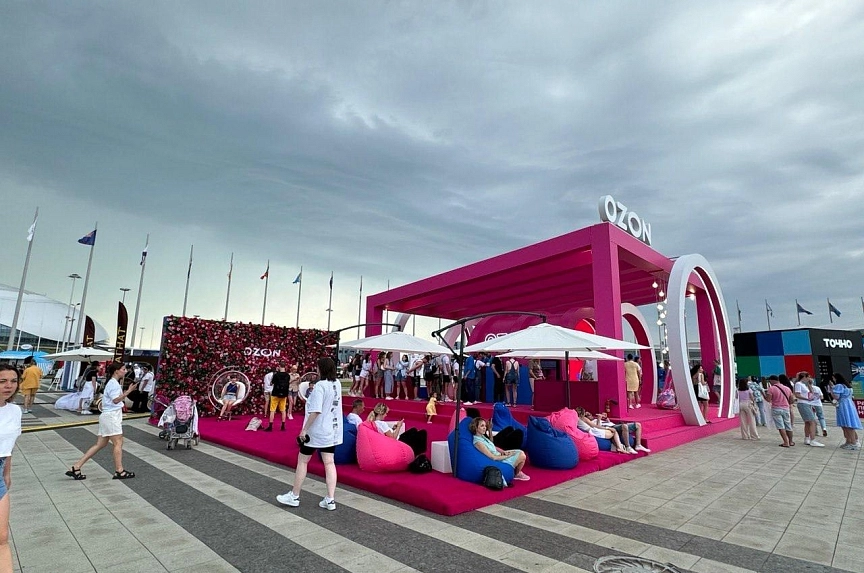 Daytime filming of branded structure in natural lighting