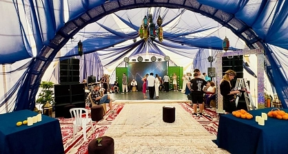 Interior decor of the arch tent in Eastern style for a wedding anniversary celebration