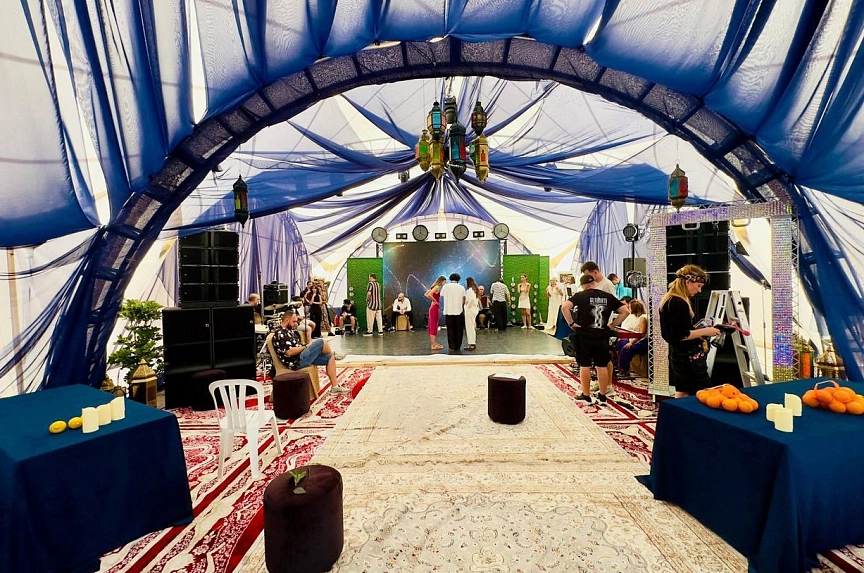 Interior decor of the arch tent in Eastern style for a wedding anniversary celebration