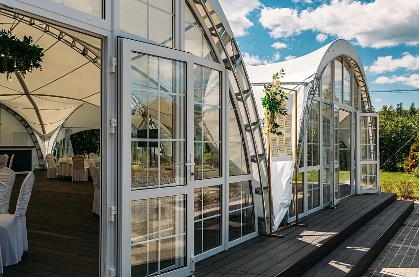 Arch tent for wedding celebration in Eastern Europe
