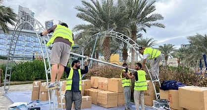 A professional installation crew dismantles the metal structure and exhibition covering for the TentProject modular arch system at the event venue in Dubai's Palm Design District following the conclusion of Mira Run 2025